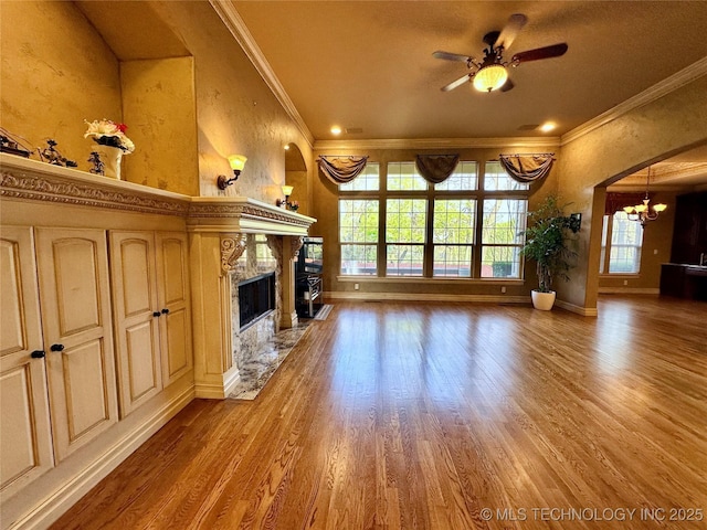 10213 S 88th E Ave, Tulsa, OK 74133 - unfurnished living room with crown molding, a chandelier, a fireplace, ceiling fan, and wood finished floors