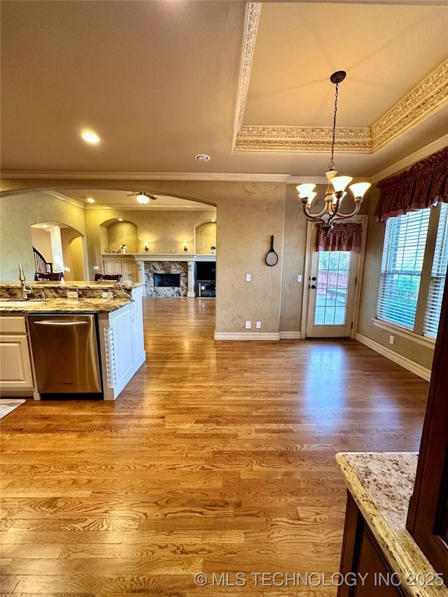 10213 S 88th E Ave, Tulsa, OK 74133 - kitchen with dishwasher, ornamental molding, open floor plan, a chandelier, and arched walkways