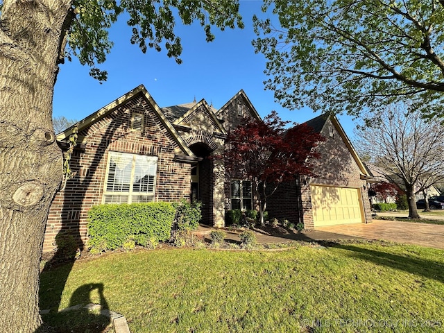 10213 S 88th E Ave, Tulsa, OK 74133 - view of front of property with brick siding, driveway, and a front lawn