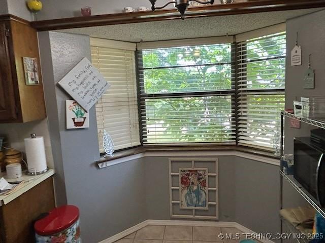 901 S Anthony St, Muskogee, OK 74403 - kitchen featuring tile patterned floors and baseboards