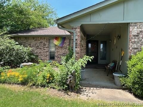 901 S Anthony St, Muskogee, OK 74403 - view of exterior entry with brick siding