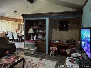 901 S Anthony St, Muskogee, OK 74403 - living room featuring lofted ceiling and wood finished floors