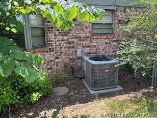 901 S Anthony St, Muskogee, OK 74403 - exterior view of central AC unit and stone siding