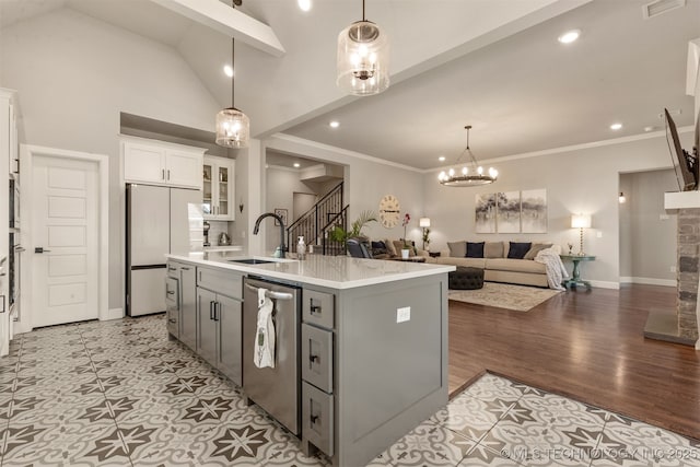 kitchen featuring a sink, gray cabinets, built in refrigerator, white cabinetry, and stainless steel dishwasher