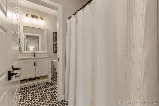 bathroom with toilet and vanity