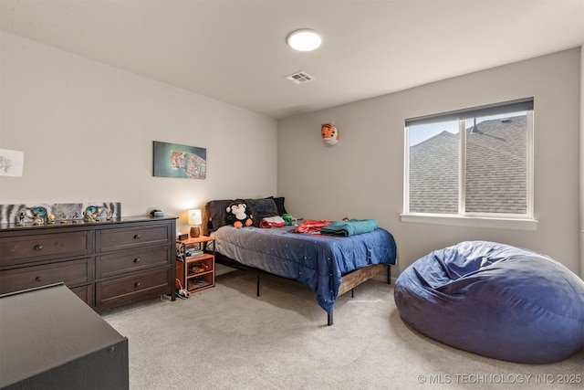 bedroom with visible vents and light colored carpet