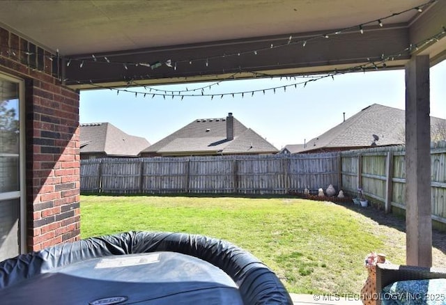 view of yard with a fenced backyard