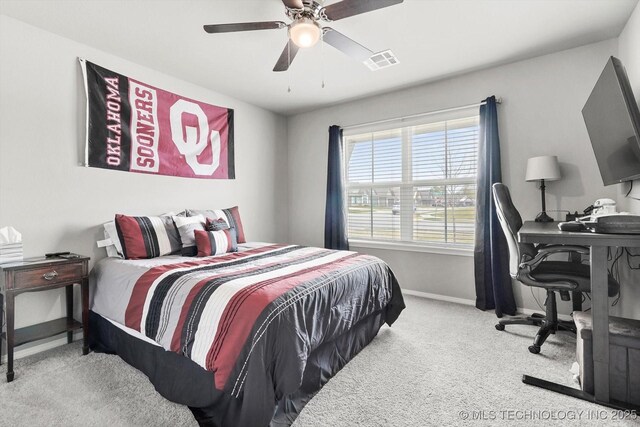 carpeted bedroom with ceiling fan, baseboards, and visible vents