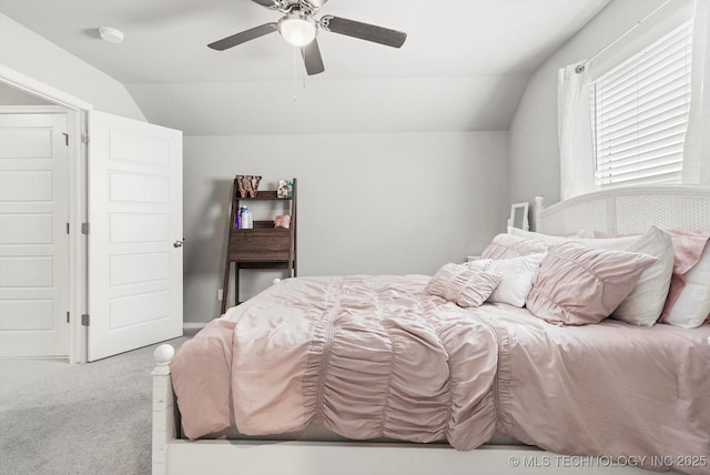 carpeted bedroom with lofted ceiling and a ceiling fan