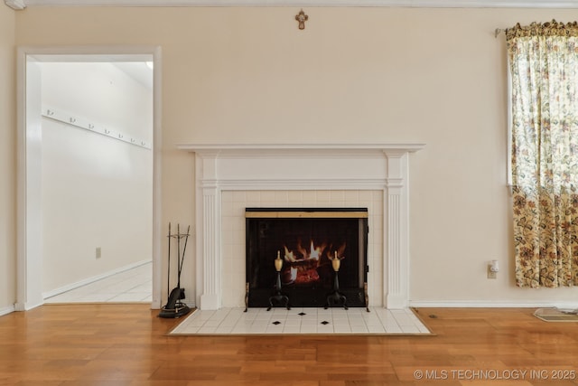 204 S Jamestown Ave, Tulsa, OK 74112 - detailed view of wood finished floors, a tile fireplace, and baseboards