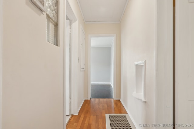 204 S Jamestown Ave, Tulsa, OK 74112 - hallway featuring light wood finished floors, baseboards, and ornamental molding