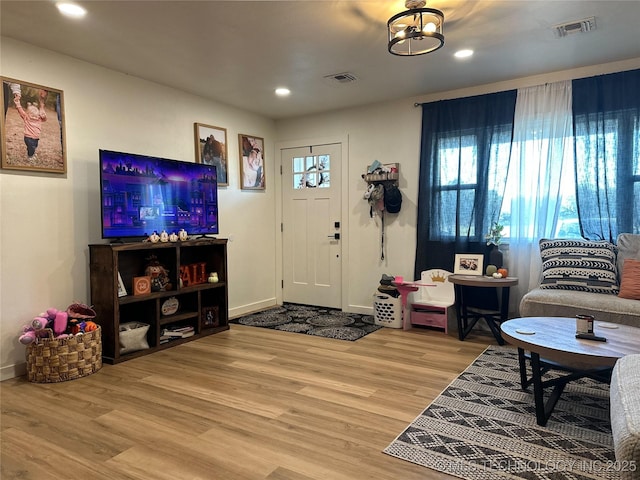 entrance foyer featuring light wood-style flooring, baseboards, visible vents, and recessed lighting