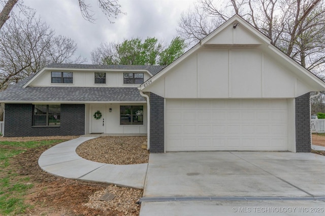 view of front of house with brick siding, an attached garage, driveway, and roof with shingles