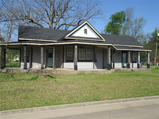 123 E Morris, Mcalester, OK 74501 - view of front of home with a front yard, a shingled roof, and covered porch