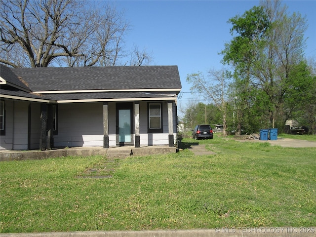 123 E Morris, Mcalester, OK 74501 - view of front of house with a porch, a shingled roof, and a front lawn