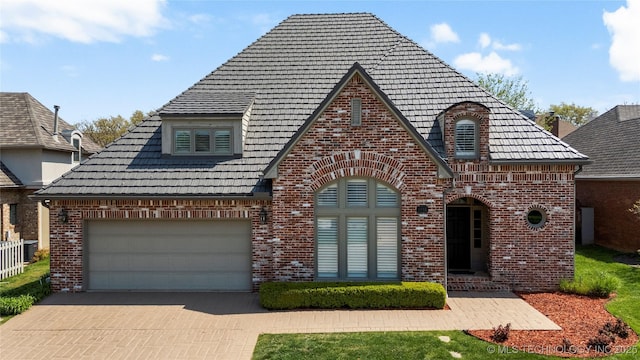 5815 S Knoxville Ave, Tulsa, OK 74135 - english style home featuring brick siding and driveway