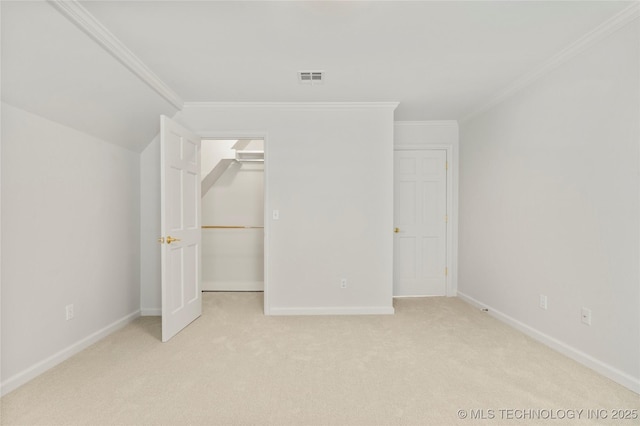 5815 S Knoxville Ave, Tulsa, OK 74135 - unfurnished bedroom with ornamental molding, visible vents, baseboards, and light carpet