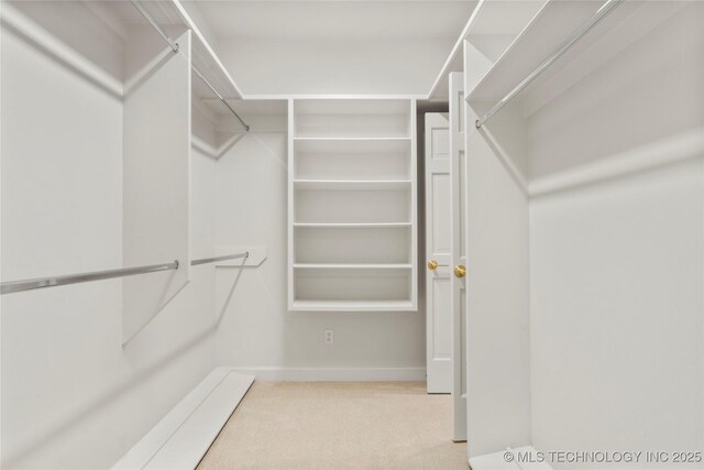 5815 S Knoxville Ave, Tulsa, OK 74135 - walk in closet with carpet flooring