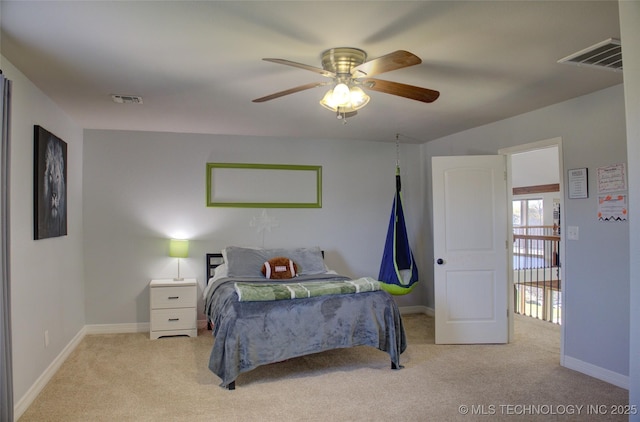 bedroom featuring baseboards, visible vents, and carpet