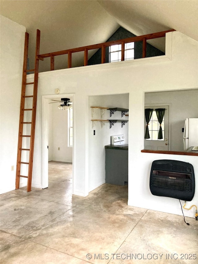 405 N Industrial Ave, Sand Springs, OK 74063 - interior space featuring heating unit, concrete flooring, and high vaulted ceiling