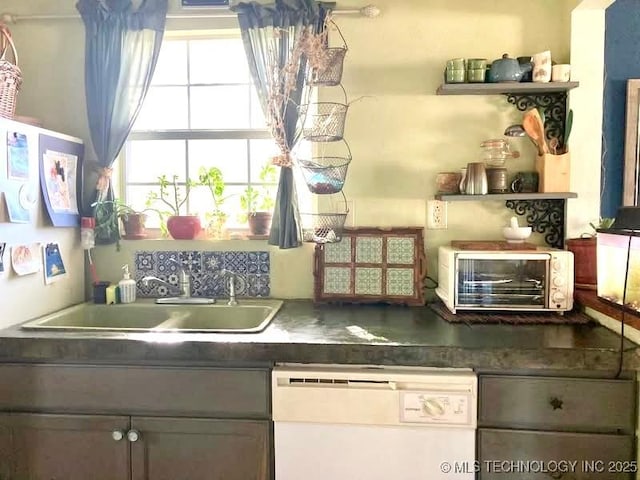 405 N Industrial Ave, Sand Springs, OK 74063 - kitchen with dark countertops, dishwasher, a toaster, and a sink
