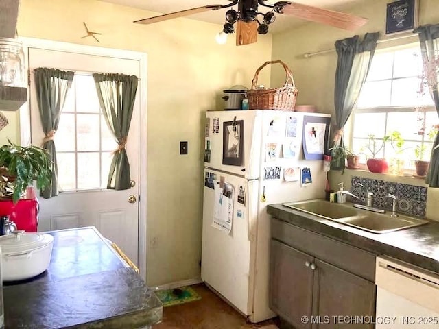 405 N Industrial Ave, Sand Springs, OK 74063 - kitchen with white appliances, a sink, ceiling fan, and a healthy amount of sunlight