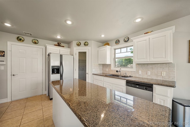 2003 Estates, Grove, OK 74344 - kitchen with refrigerator with ice dispenser, white cabinetry, decorative backsplash, dishwasher, and a sink