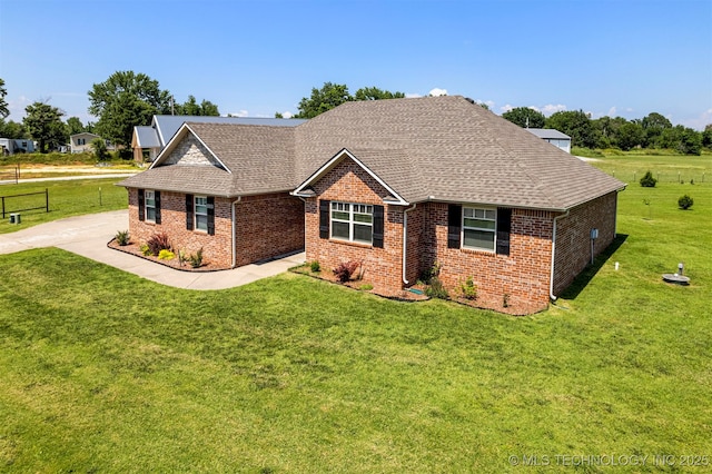 2003 Estates, Grove, OK 74344 - view of front of house with roof with shingles, brick siding, and a front lawn