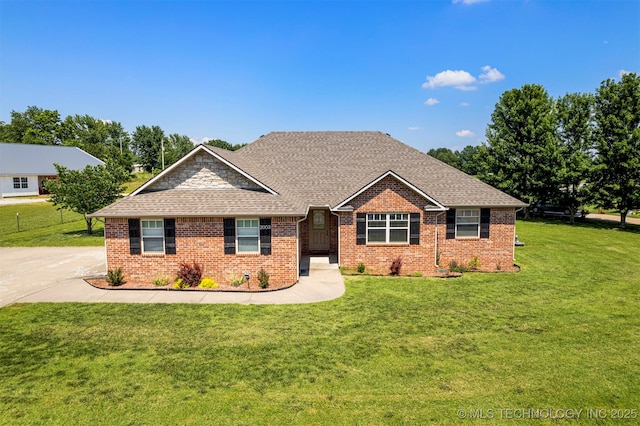 2003 Estates, Grove, OK 74344 - view of front of property with roof with shingles, a front yard, and brick siding