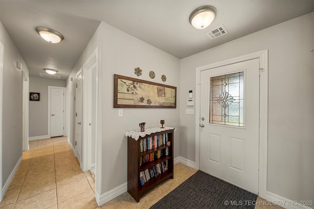 2003 Estates, Grove, OK 74344 - entryway featuring light tile patterned floors, baseboards, and visible vents