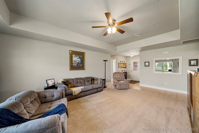 2003 Estates, Grove, OK 74344 - living area featuring baseboards, light carpet, visible vents, a tray ceiling, and ceiling fan