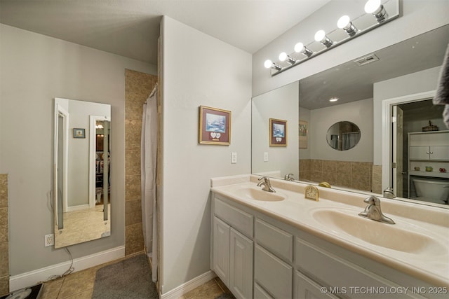 2003 Estates, Grove, OK 74344 - full bathroom featuring a sink, tile patterned floors, double vanity, and baseboards