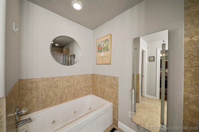 2003 Estates, Grove, OK 74344 - full bath with tile patterned floors, a jetted tub, and baseboards