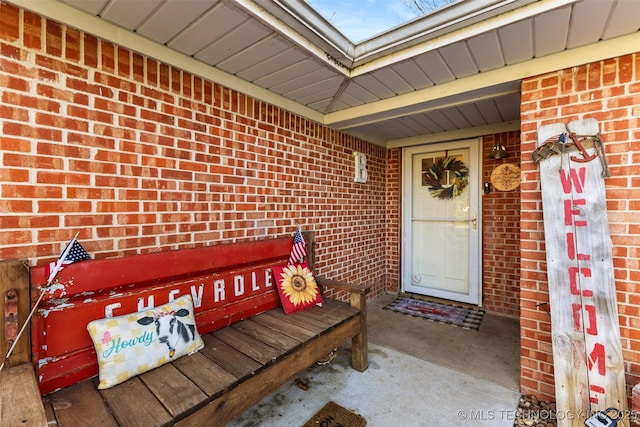 property entrance with brick siding