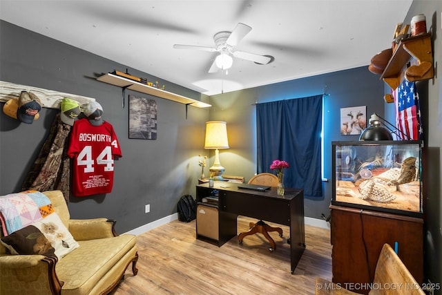 office featuring baseboards, a ceiling fan, and wood finished floors