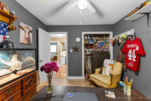 sitting room featuring light wood-style floors and ceiling fan