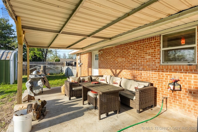 view of patio with an outdoor structure, outdoor lounge area, and fence