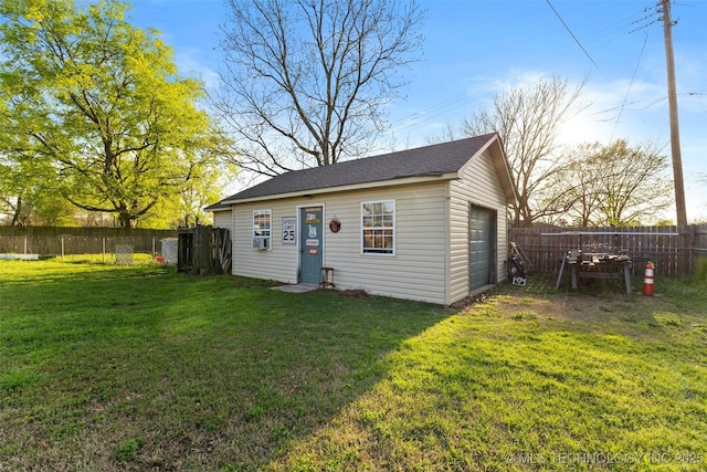 view of outbuilding with a fenced backyard and an outdoor structure