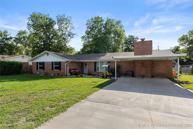 221 S Harvey, Ada, OK 74820 - single story home featuring driveway, brick siding, a chimney, and an attached carport