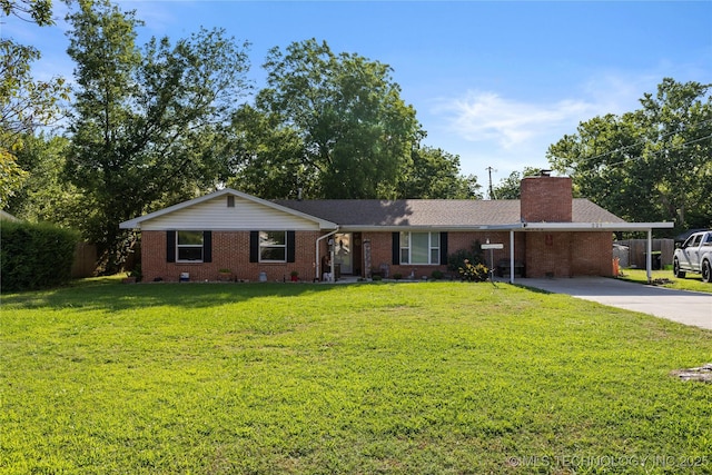 221 S Harvey, Ada, OK 74820 - ranch-style house featuring brick siding, concrete driveway, a chimney, and an attached carport