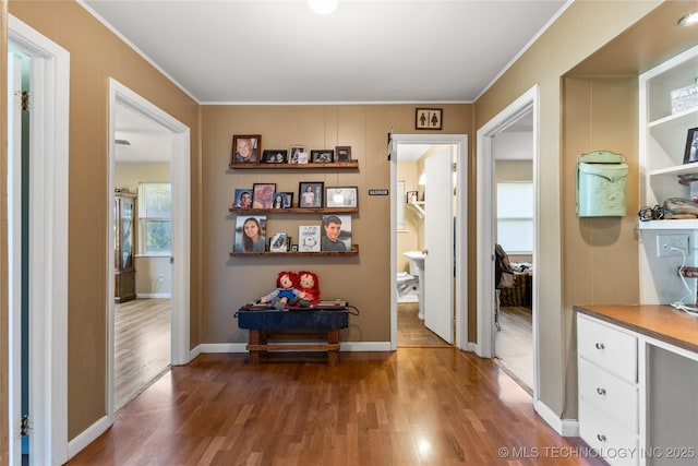 221 S Harvey, Ada, OK 74820 - corridor with light wood-type flooring and crown molding