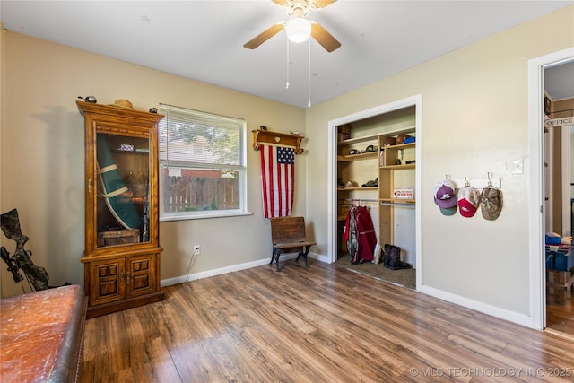 221 S Harvey, Ada, OK 74820 - bedroom featuring wood finished floors, a closet, and a ceiling fan