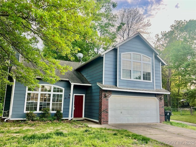 split level home featuring an attached garage, driveway, brick siding, and roof with shingles