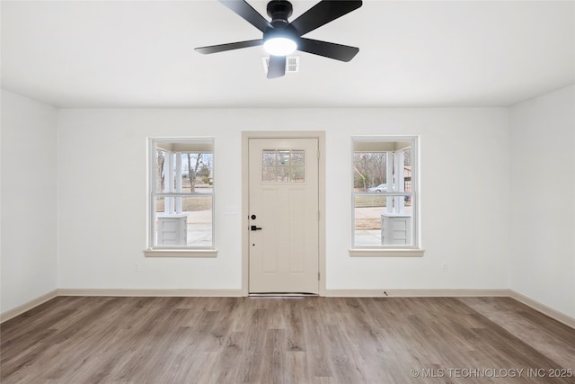 2002 W Driftwood Dr, Claremore, OK 74017 - entryway with visible vents, baseboards, a ceiling fan, and wood finished floors