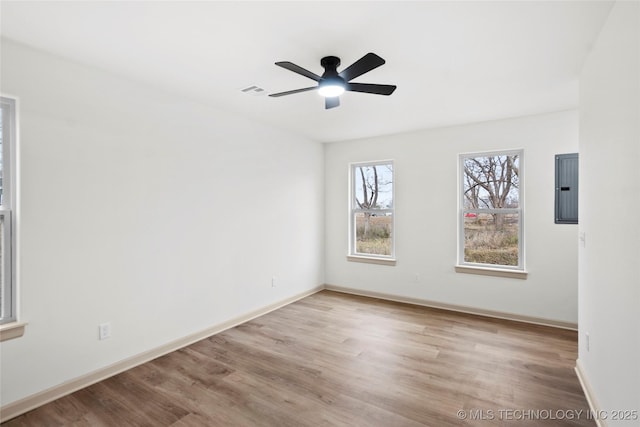 2002 W Driftwood Dr, Claremore, OK 74017 - empty room with ceiling fan, wood finished floors, electric panel, and baseboards