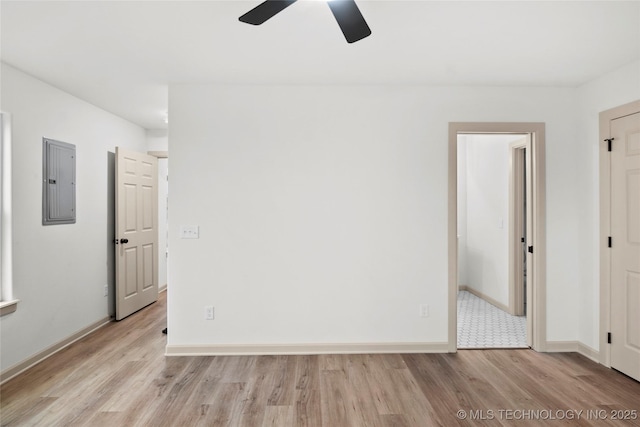 2002 W Driftwood Dr, Claremore, OK 74017 - interior space with electric panel, light wood-style flooring, baseboards, and ceiling fan