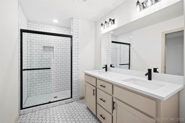 2002 W Driftwood Dr, Claremore, OK 74017 - full bathroom with a shower stall, double vanity, and a sink
