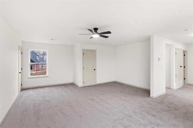 2002 W Driftwood Dr, Claremore, OK 74017 - unfurnished room with light carpet, baseboards, and a ceiling fan