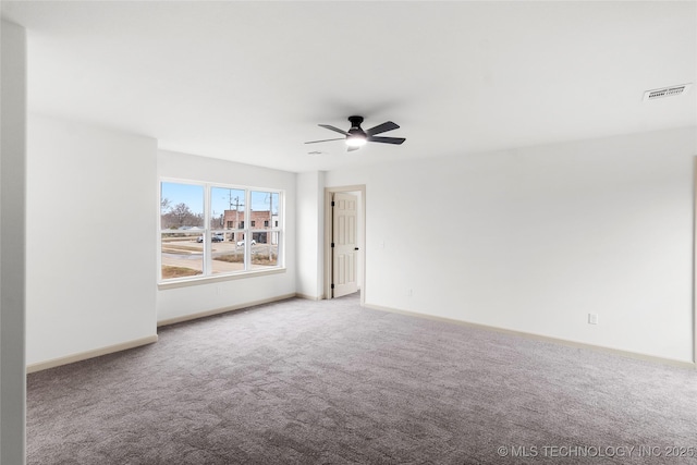 2002 W Driftwood Dr, Claremore, OK 74017 - carpeted spare room with visible vents, ceiling fan, and baseboards