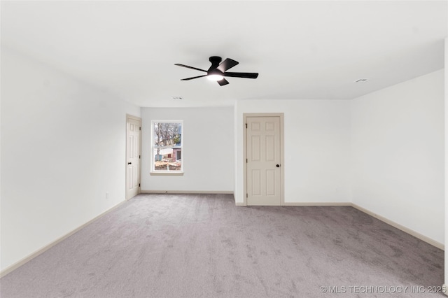 2002 W Driftwood Dr, Claremore, OK 74017 - spare room featuring light carpet, baseboards, and a ceiling fan